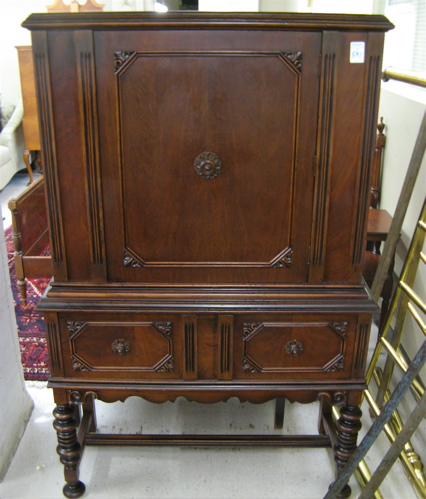 Appraisal: WALNUT CHINA CABINET ON STAND American c 's the cabinet