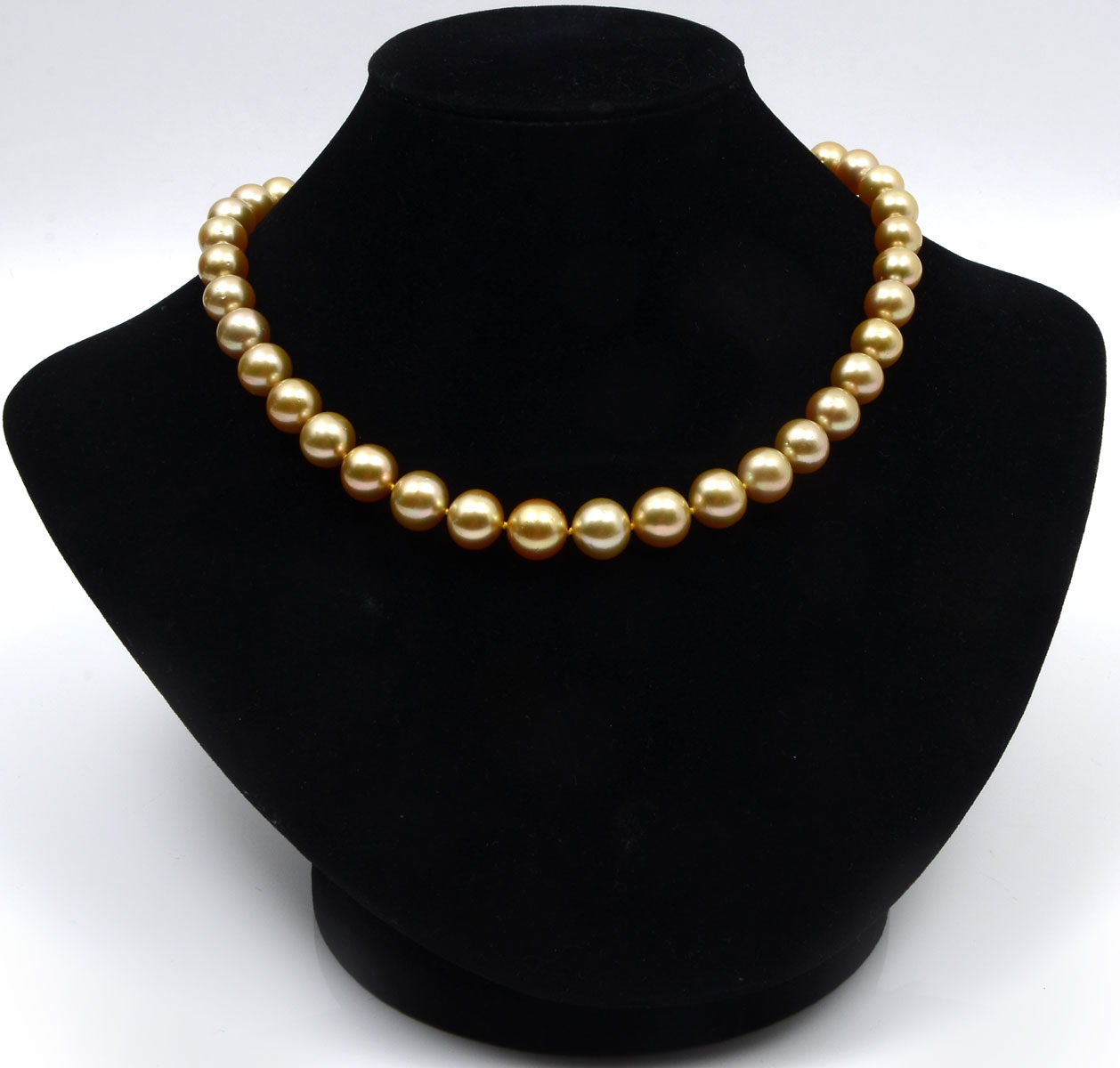 Appraisal: GOLDEN SOUTH SEAS PEARL NECKLACE Single strand of graduated cultured