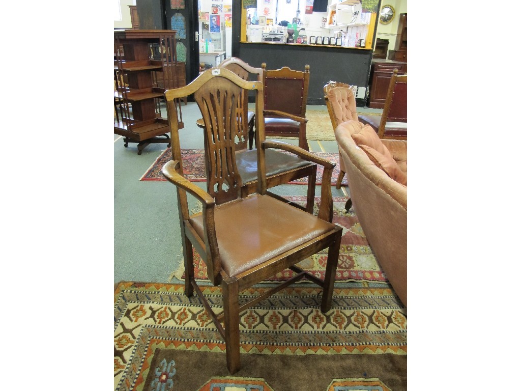 Appraisal: Pair of elbow chairs with pierced backs