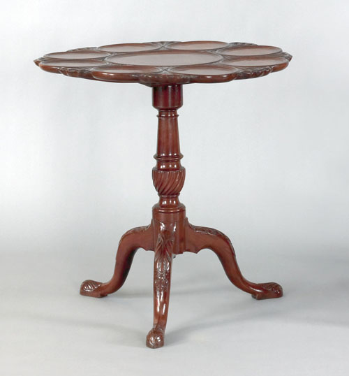 Appraisal: George III carved mahogany supper table the shaped top with