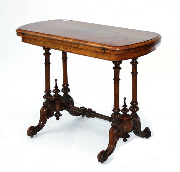 Appraisal: A Victorian walnut games table height in width in depth