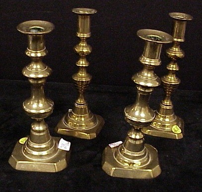 Appraisal: Two pairs of th C brass push up candlesticks beehive