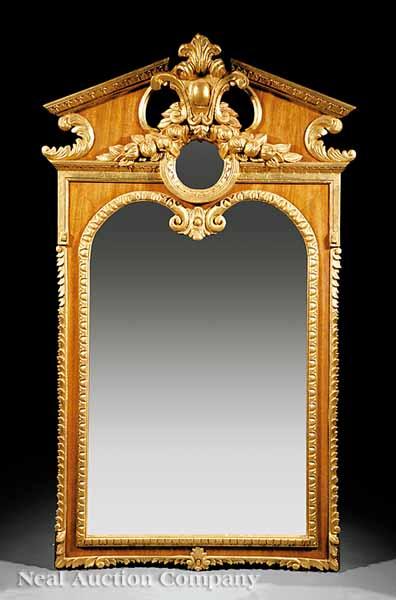 Appraisal: A George II-Style Mahogany and Giltwood Mirror in the manner