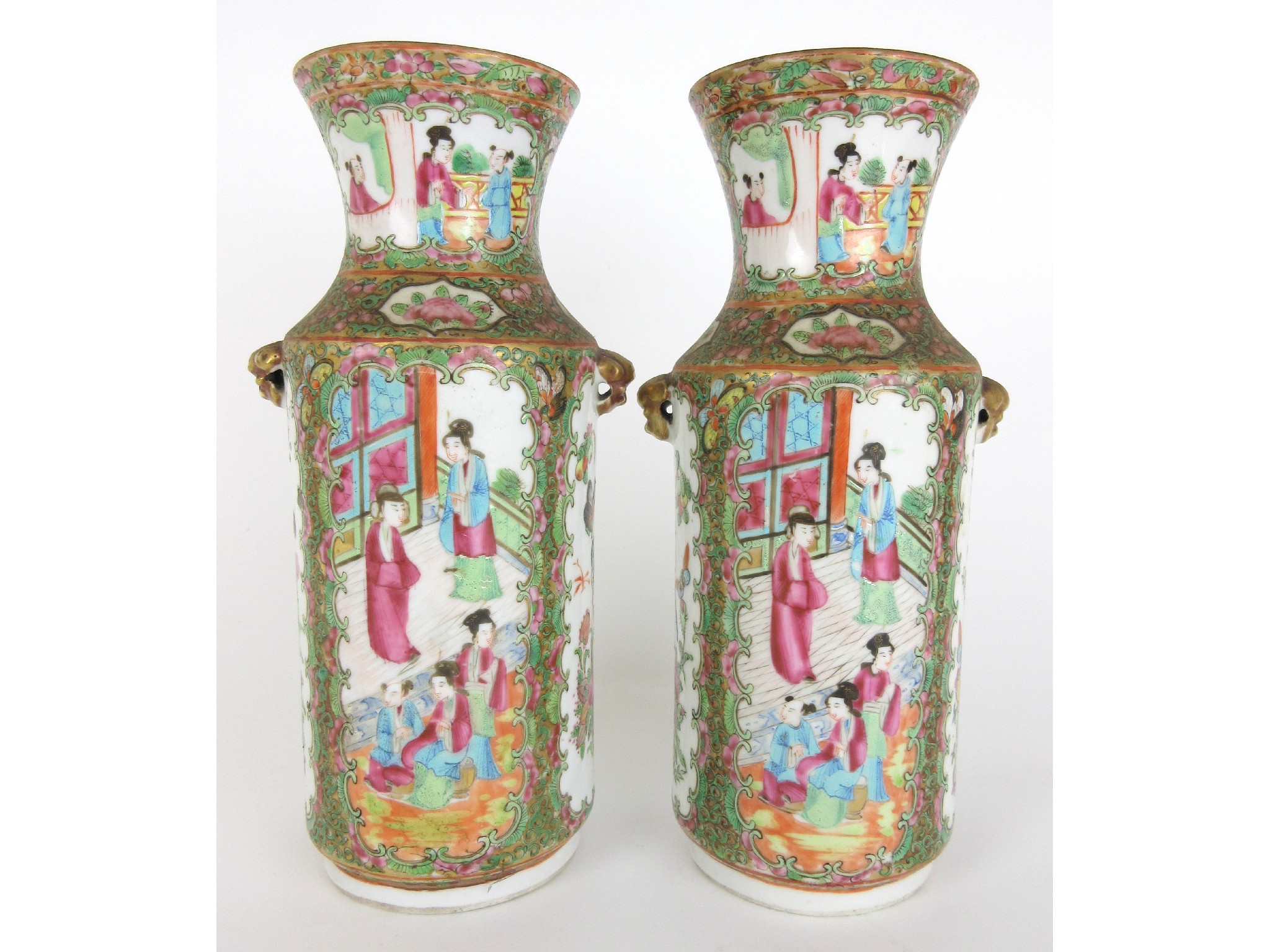 Appraisal: A pair of Cantonese famille rose cylindrical vasespainted with panels