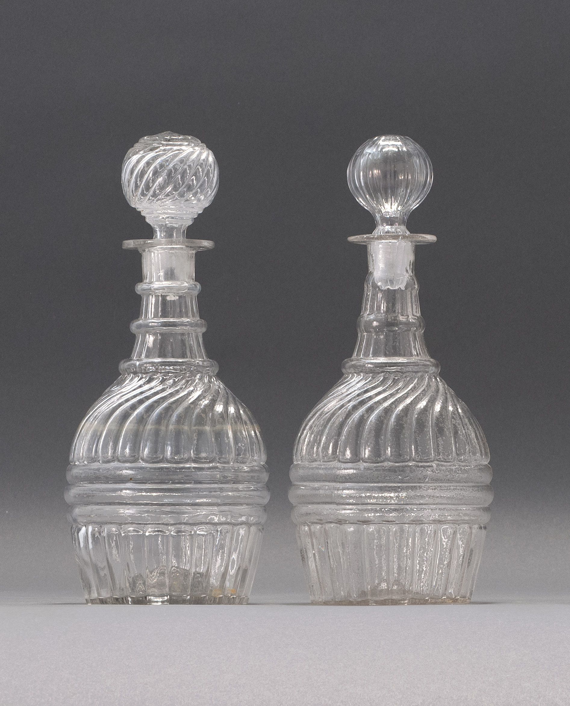 Appraisal: PAIR OF CLEAR GLASS BLOWN -MOLD DECANTERS Second Quarter of