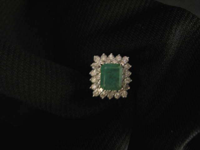 Appraisal: Emerald Diamond Ring rectangular carat emerald surrounded by diamonds totaling