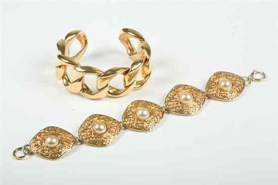 Appraisal: TWO CHANEL GOLD-TONE BRACELETS One open-end cuff bracelet of chain