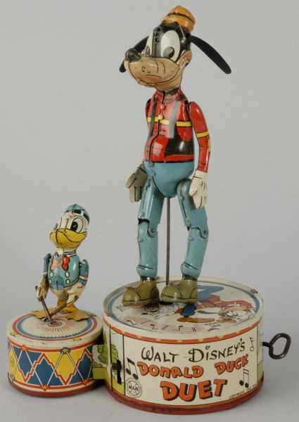 Appraisal: Tin Marx Disney Donald Duck Duet Wind-Up Toy Description American