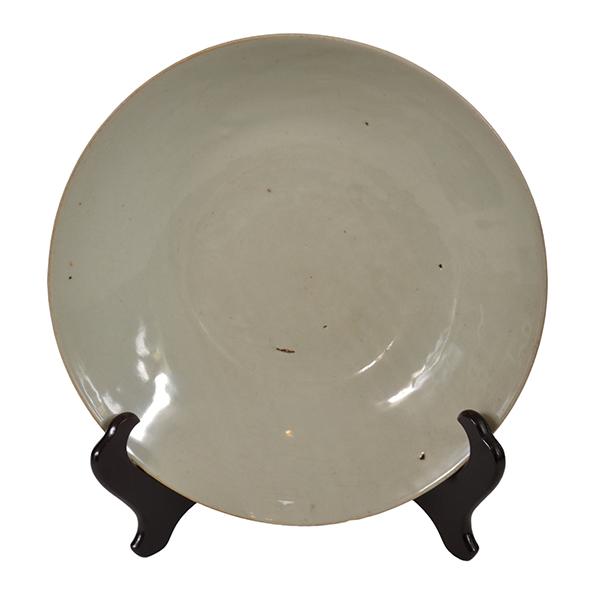 Appraisal: A LARGE CHINESE ANTIQUE CELADON PLATE the natural creamy glaze