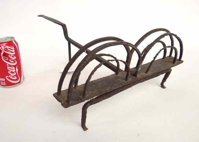 Appraisal: Late th c New England wrought iron toaster Rat tail