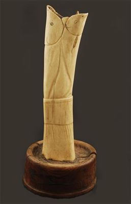 Appraisal: An Inuit carved bone vase modelled as a cuff issuing