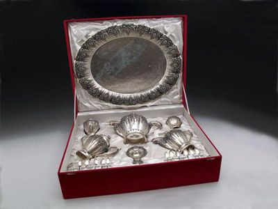 Appraisal: A presentation Indonesian metalware tea service marked comprising an oval