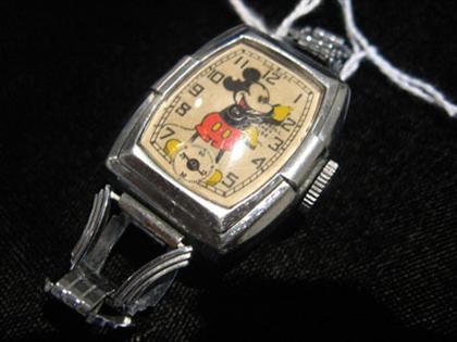 Appraisal: Ingersoll Mickey Mouse wristwatch Oblong base metal case offwhite face