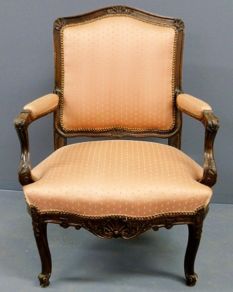 Appraisal: French walnut open armchair with carved shells and leaves h