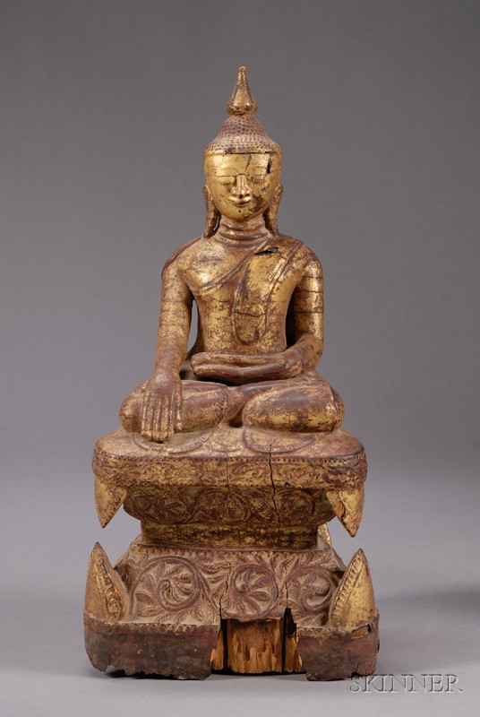 Appraisal: Carved Wooden Buddha Burma th th century surface lacquered in