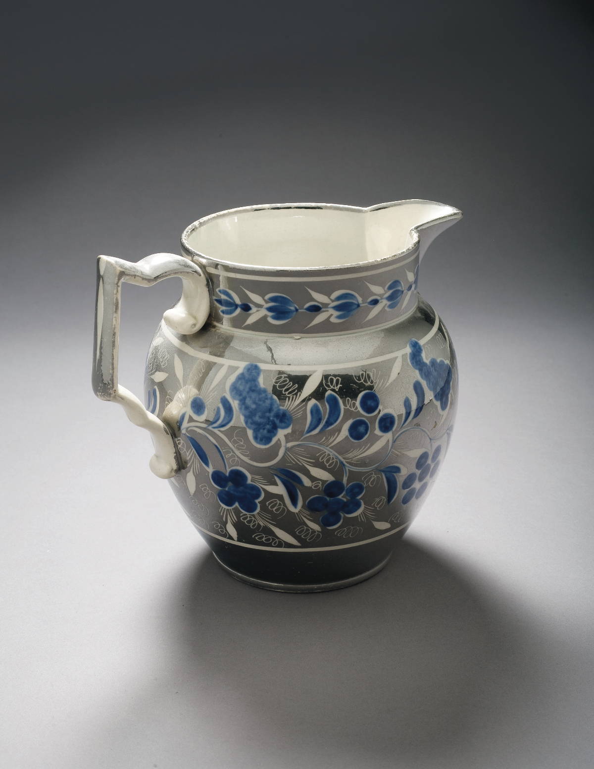 Appraisal: STAFFORDSHIRE SILVER RESIST LUSTRE AND BLUE ENAMEL-DECORATED JUG CIRCA -