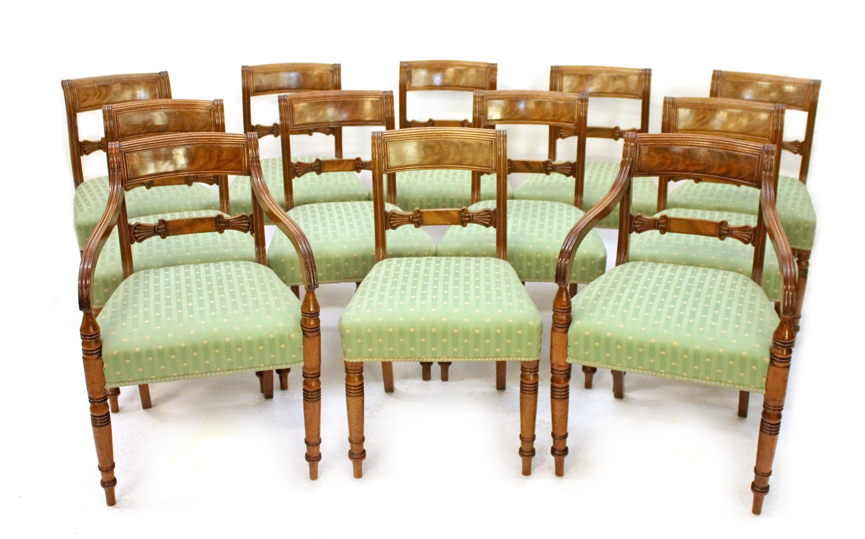 Appraisal: A set of twelve mid th century mahogany dining chairs