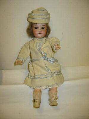 Appraisal: An Armand Marseille bisque headed doll with brown sleeping eyes