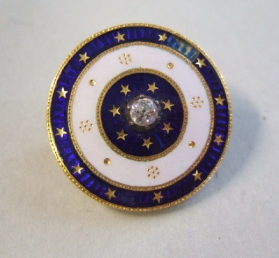 Appraisal: A gold diamond set and enameled circular brooch mounted with