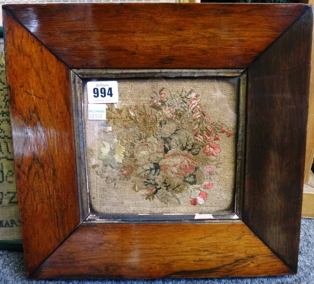 Appraisal: A Victorian embroidered foliate panel in a wide square rosewood