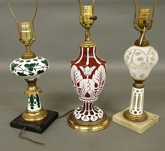 Appraisal: - Three colored glass cut-to-clear lamps largest with brass base