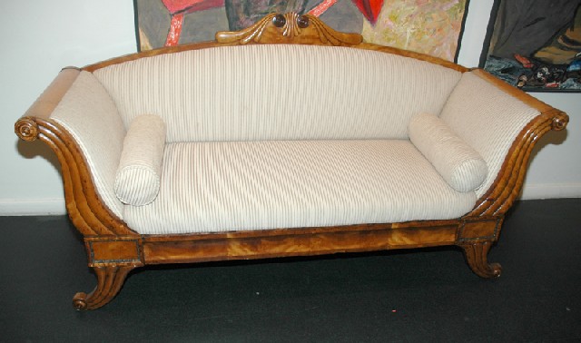 Appraisal: A BIEDERMEIER CIRCASSIAN WALNUT SETTEE Circa The bowed crest rail