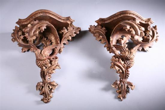 Appraisal: PAIR CARVED GILTWOOD BRACKETS th century Shaped shelf suspending scrolling