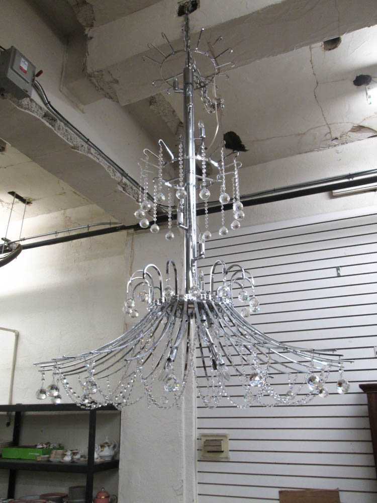 Appraisal: A LARGE THREE-TIER CRYSTAL AND CHROMED METAL CHANDELIER unknown brand