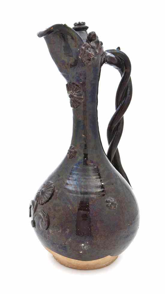 Appraisal: A Continental Glazed Stoneware Ewer of bulbous form having an