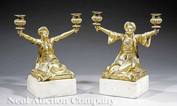 Appraisal: A Pair of English Gilt Bronze Figural Candelabra mid- th