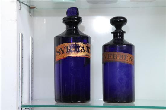 Appraisal: TWO DRUGGIST BOTTLES Stoppered cobalt bottles with paper labels Syr