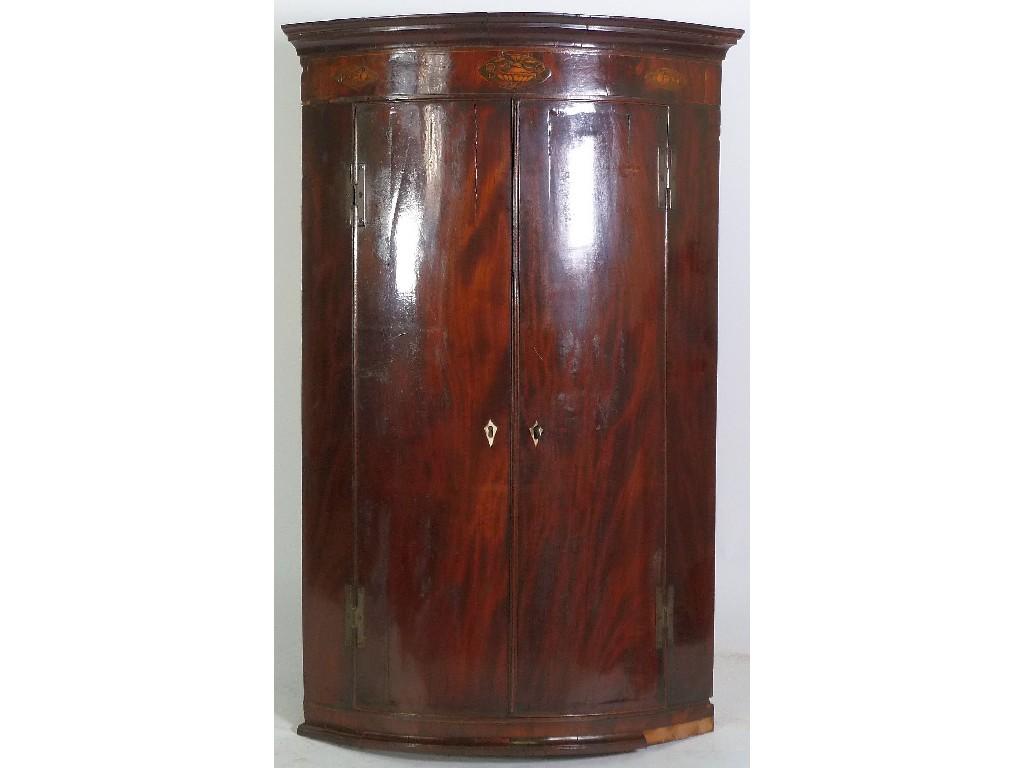 Appraisal: GEORGE III INLAID MAHOGANY BOW FRONTED CORNER CUPBOARD the moulded