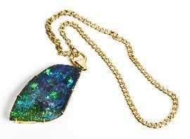 Appraisal: A treated opal pendant mounted in ct gold approximately x