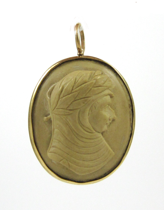 Appraisal: LAVA CAMEO AND YELLOW GOLD PENDANT BROOCH with an oval