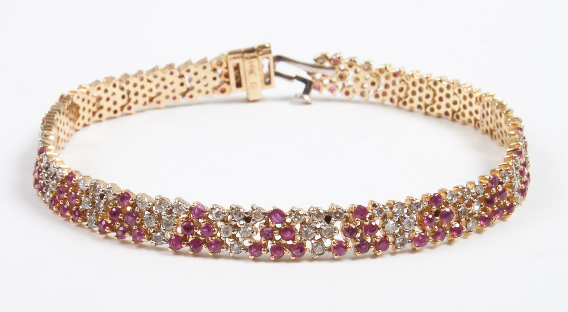 Appraisal: Lady's gold diamond ruby pave bracelet marked K in L