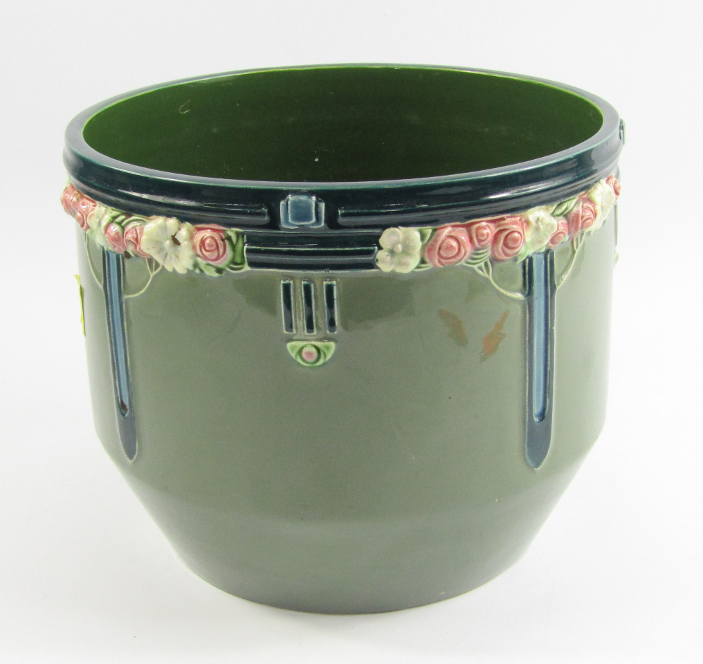 Appraisal: An Eichwald pottery jardiniere moulded with stylised flowers against a