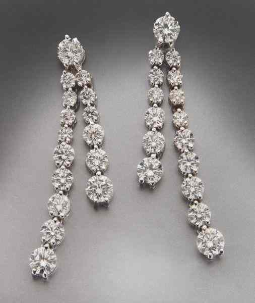 Appraisal: K gold and diamond cascade earringsfeaturing round brilliant cut diamonds