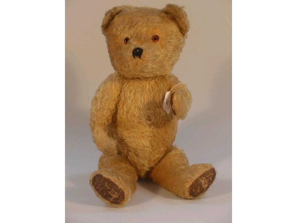 Appraisal: A golden mohair Teddy bear with articulated head and limbs