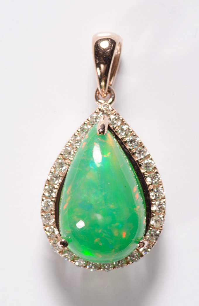 Appraisal: GREEN OPAL DIAMOND AND FOURTEEN KARAT GOLD PENDANT featuring a