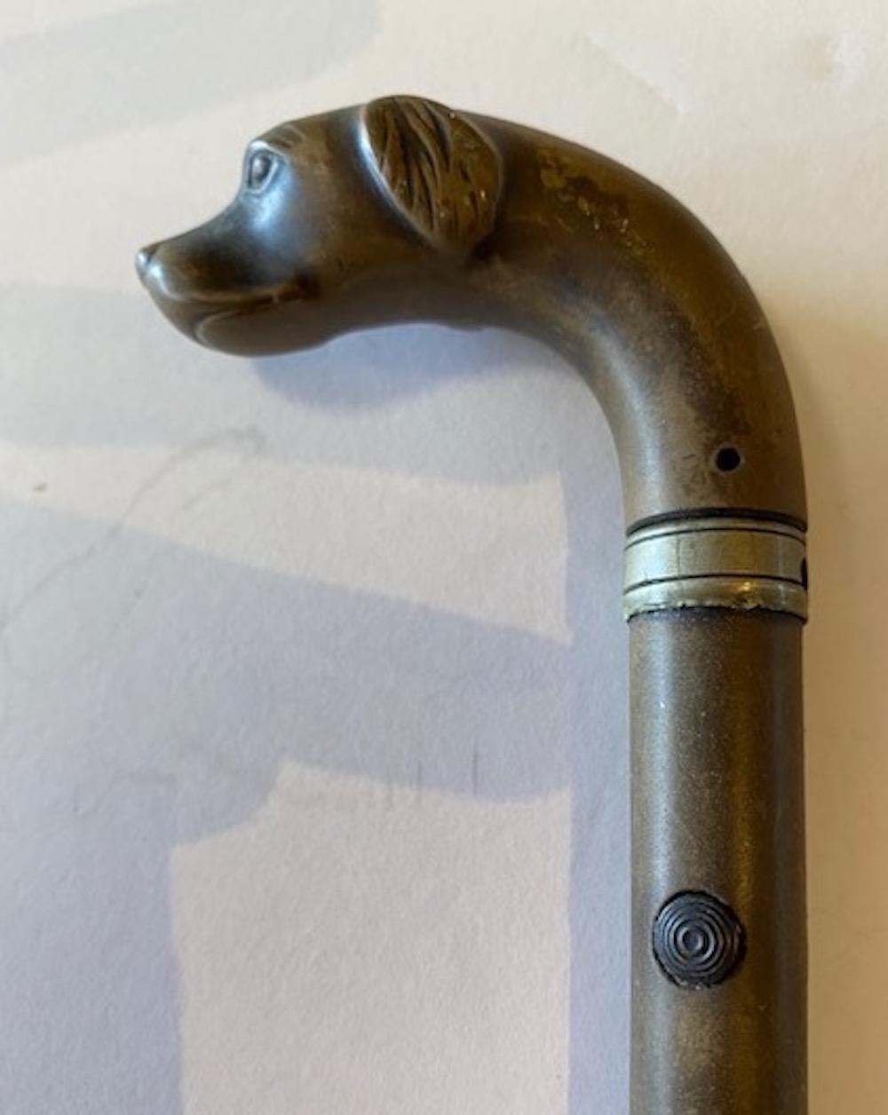 Appraisal: FRENCH WOOD AND STEEL DOG-HEADED CONCEALED GUN CANELate th early