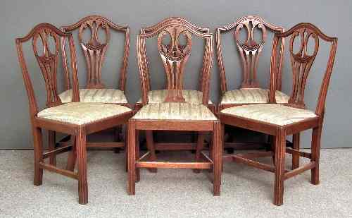 Appraisal: A set of six mahogany dining chairs of Hepplewhite design