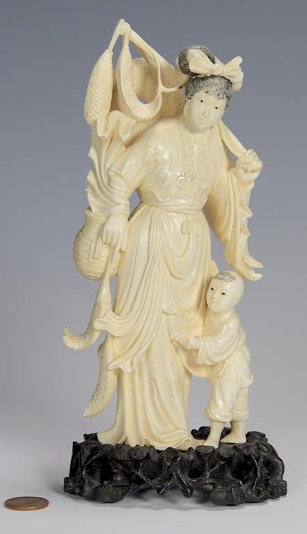 Appraisal: Ivory okimono woman and child Japanese Ivory Okimono figure of