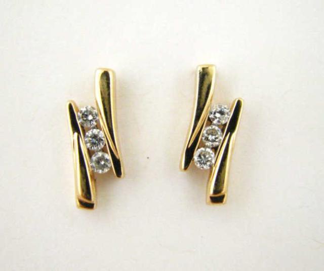 Appraisal: Pair of K yellow gold free-form diamond earrings with three