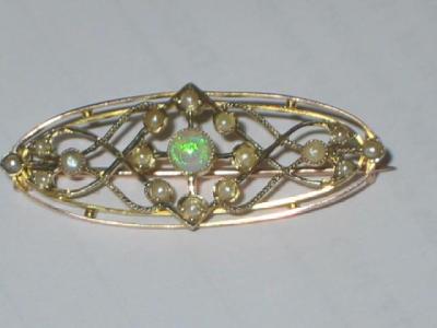 Appraisal: A VICTORIAN OPAL AND PEARL BROOCH of oval open work