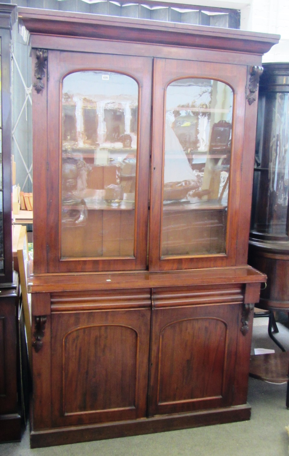 Appraisal: A Victorian mahogany bookcase cabinet with pair of cushion drawers