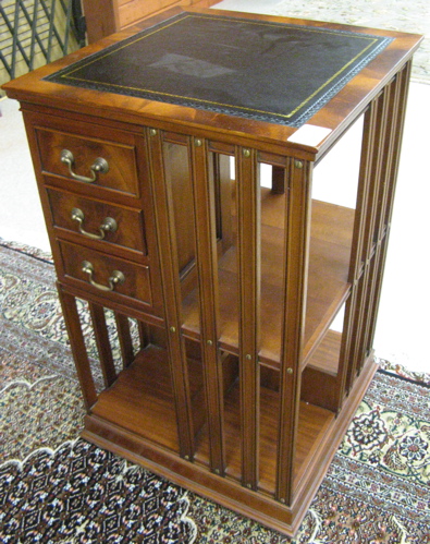 Appraisal: GEORGE III STYLE REVOLVING MAHOGANY BOOKCASE crafted in a square