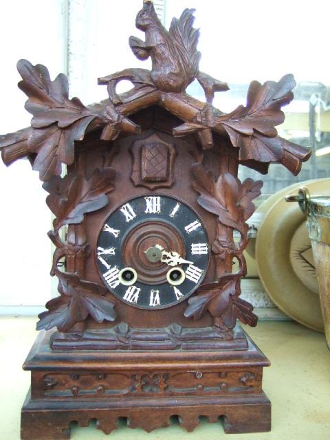 Appraisal: A Blackforest cuckoo clock with two winding holes to the