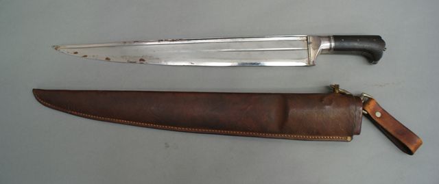 Appraisal: A large Kyber knife inch single edged blade silvered fittings