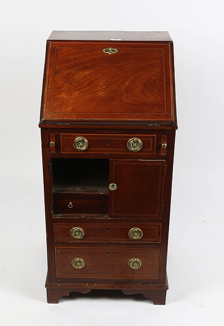 Appraisal: AN EDWARDIAN MAHOGANY SATINWOOD INLAID NARROW BUREAU fall front above