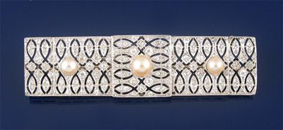 Appraisal: A diamond and pearl set pierced plaque brooch the pierced